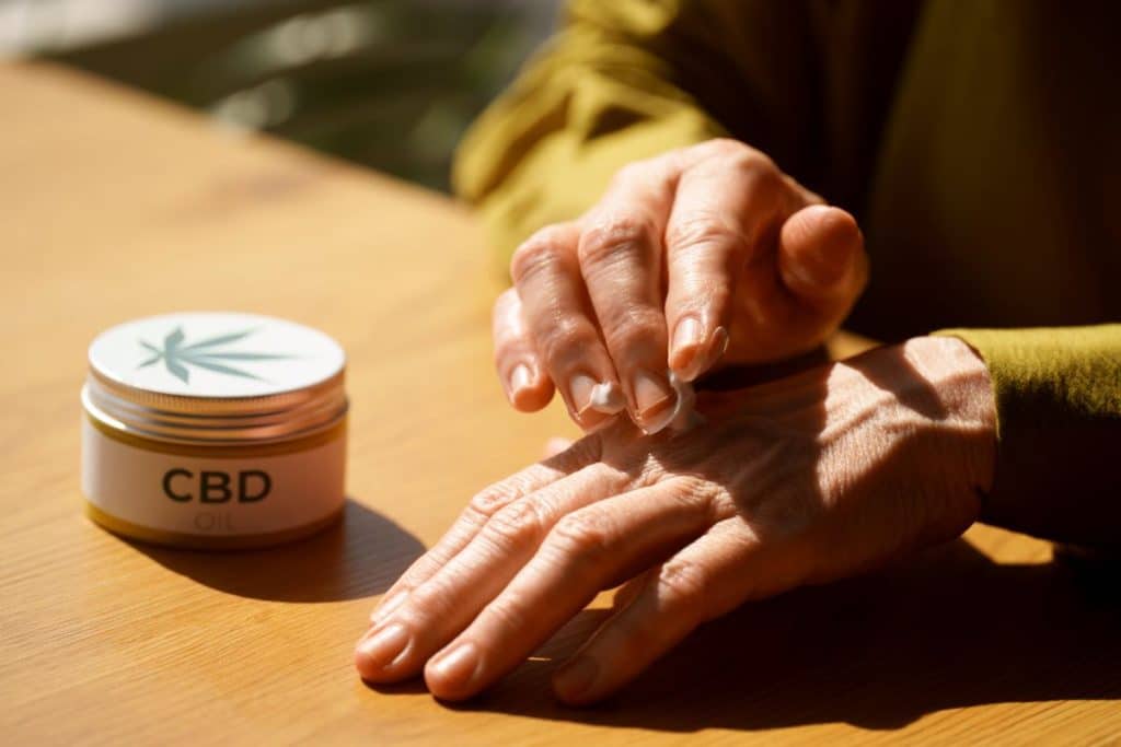 close up woman using cbd cream pain