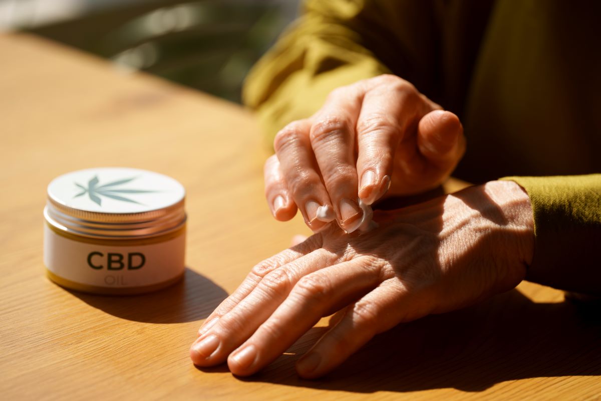 close up woman using cbd cream pain